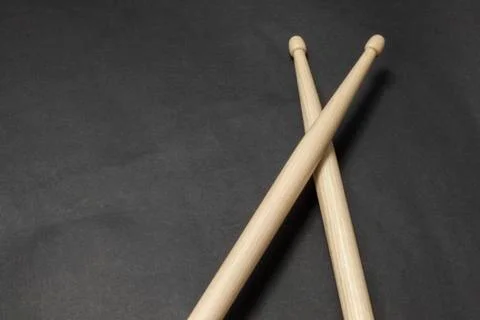 Drumsticks on a black background. Stock Photos