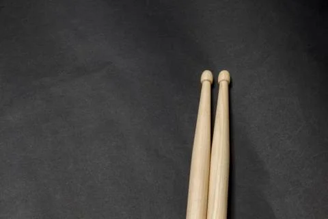 Drumsticks on a black background. Stock Photos