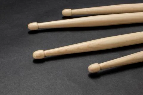 Drumsticks on a black background. Stock Photos