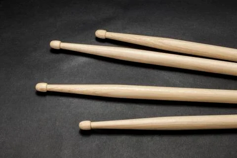 Drumsticks on a black background. Stock Photos