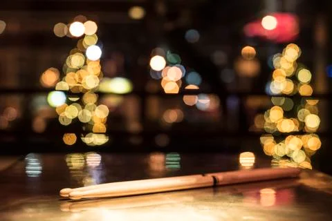 Drumsticks on a gold table Stock Photos
