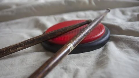 Drumsticks on a practice pad Stock Photos