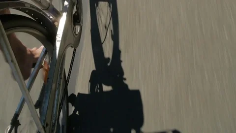 Drunk and careless cyclist on the road. Reflection shade bicycle on the road. Stock Footage 70210997