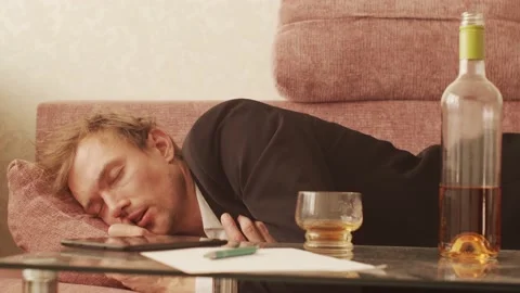 Drunk Businessman Sleeping on Sofa Stock Footage 166058657
