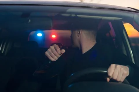 Drunk driver chased by police while driving car Stock Photos