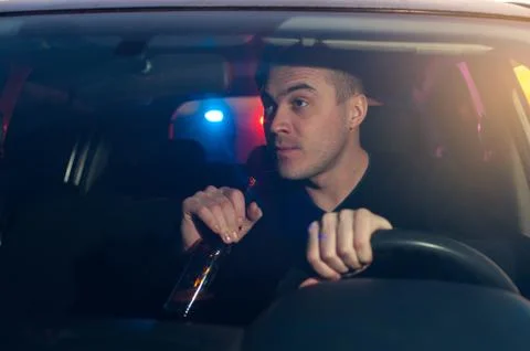 Drunk driver chased by police while driving car 스톡 사진