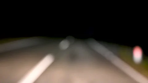A drunk driver drives a car at night. Dangerous driving. Stock Footage 229865163