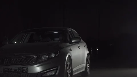 Drunk driver sits behind the wheel, night scene Stock Footage 97278090