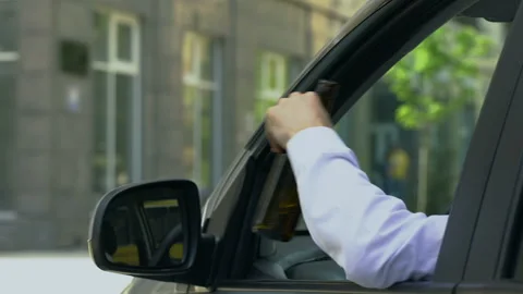 Drunk driver stops at traffic light, drinking beer while driving, car crash risk Stock Footage 91611601