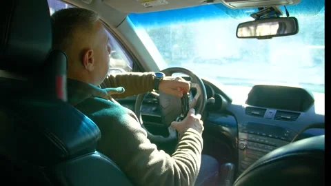 Drunk driving. The driver drinks whiskey while driving. Stock Footage 320356807