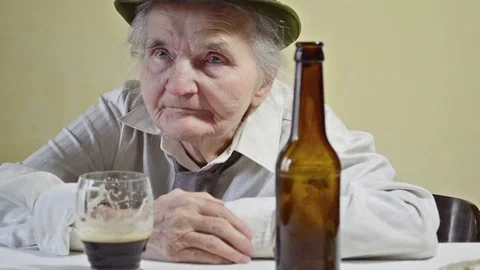 Drunk elderly woman Stock Footage 97887779