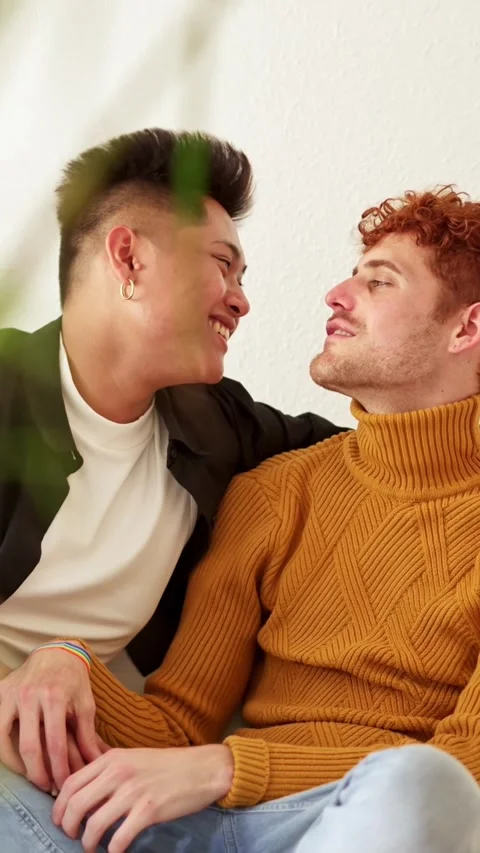Drunk gay man gets affectionate with his partner Stock Footage 242332088