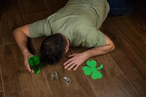 Drunk guy passed out at St Patricks Day celebration party Stock Photos