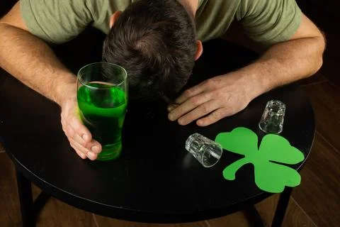 Drunk guy passed out at St Patricks Day celebration party Stock Photos