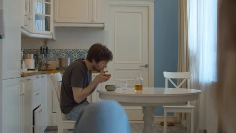 A drunk husband lights a cigarette Stock Footage 129230717