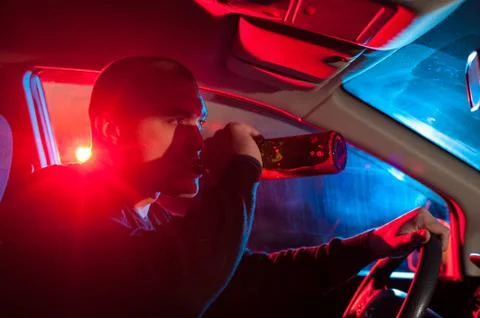 Drunk man is caught driving under alcohol Stock Photos