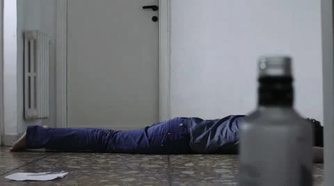 Drunk man committed suicide and left a note and an empty bottle on the floor nex Stock Footage 24718424