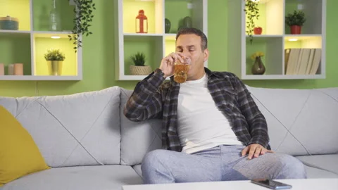 Drunk man drinking alcohol thoughtful an... | Stock Video | Pond5