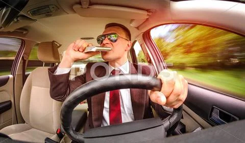 Drunk man driving a car vehicle. Stock Photos