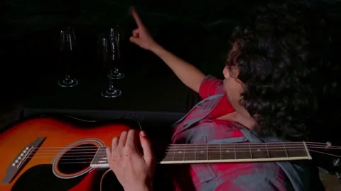 Drunk Man enjoying a glass of red wine talking with glasses at night with a.. Stock Footage 262898084