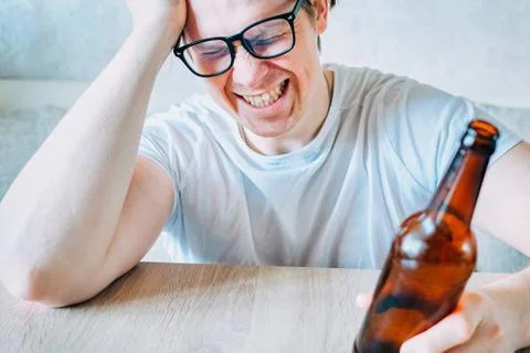 A drunk man is experiencing a deep personal crisis. Stock Photos