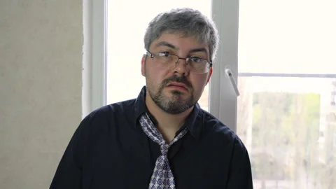 Drunk man in glasses talking 4K Stock Footage 129529435