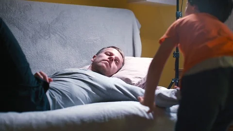 A drunk man lies on a sofa in a room at home. Stock Footage 122317437