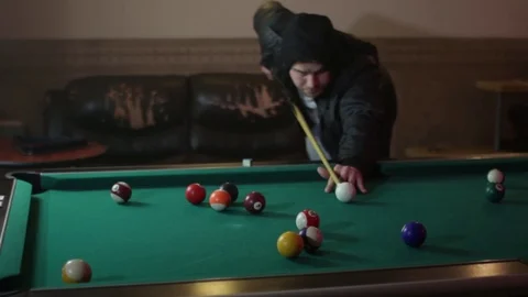 Drunk man playing billiards and drinking beer2 Stock Footage 83136929