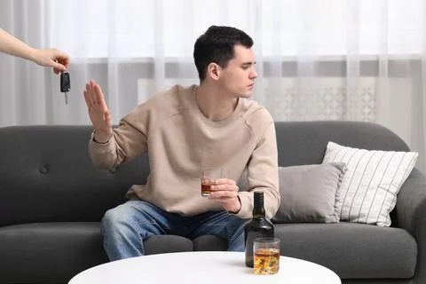 Drunk man refusing drive car while woman suggesting him keys, closeup. Don'.. Stock Photos