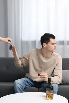 Drunk man refusing drive car while woman suggesting him keys, closeup. Don'.. Stock Photos