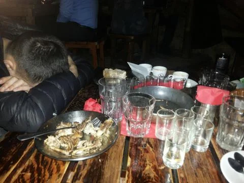 Drunk man sleeping on table Stock Photos