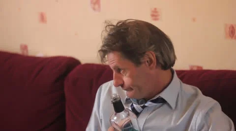 Drunk man smiles Stock Footage 25641955