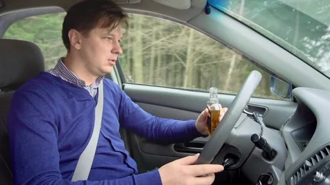Drunk man at the wheel. Driving while intoxicated. Stock Footage 88650347