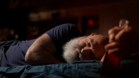 Drunk middle-aged man sleeps with liquor bottle, alcohol addiction concept Stock Footage 342520856