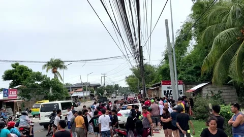 Drunk motorcyclist crashed into car, crowd gathered people Asia Philippines Stock Footage 237635084
