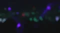 Drunk person looking in darkness at people on dance floor HD Footage