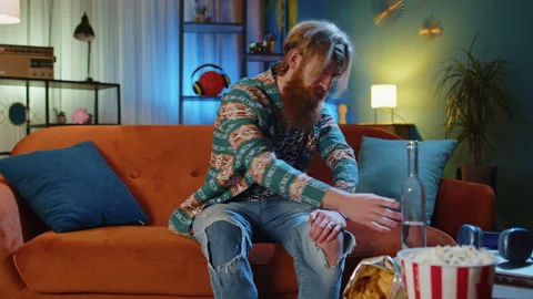 Drunk redhead man drinks vodka from bottle problem, break up, depressed feeling Stock Footage 228321687