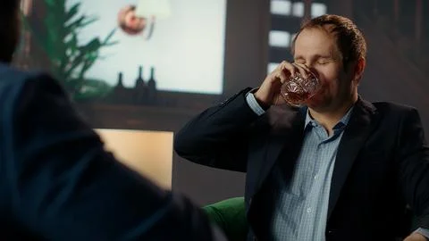 Drunk upper class elite society member being loud and obnoxious at social club Stock Photos