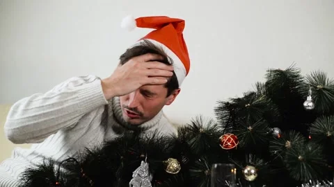 Drunk young man in santa hat waking up with headache after Christmas Stock-Footage 165855493