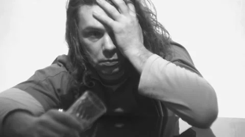 Drunkard wakes up sitting at the table,black and white Vídeo Stock 35685373