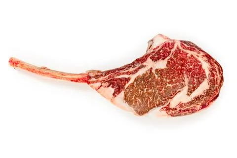 Dry aged raw tomahawk beef steak isolated on white background Stock Photos