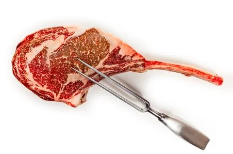 Dry aged raw tomahawk beef steak isolated on white background, front view, cl Stock Photos