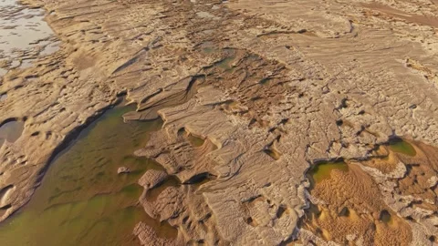 Dry Amazon riverbed reveals parched ground, cracked soil, shrunken water pools 스톡 동영상 308406508