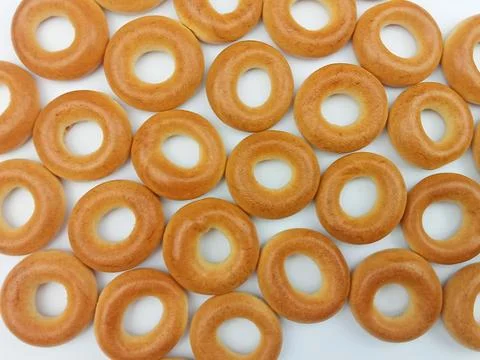 Dry bagels pattern on white background Stock Photos