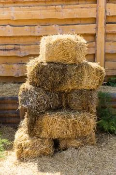 Dry baled hay stack, rural countryside background Stock Photos