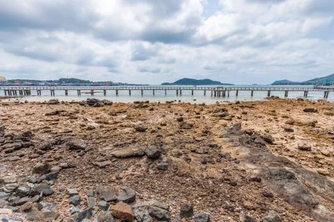 Dry beach with cloudy sky Stock Photos
