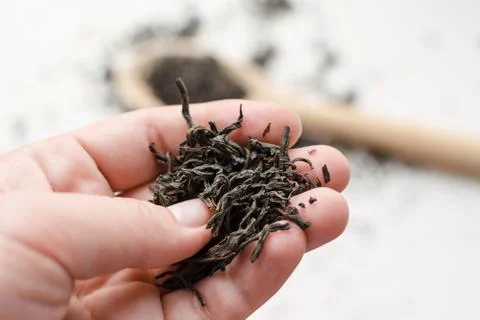 Dry black tea leaves Stock Photos