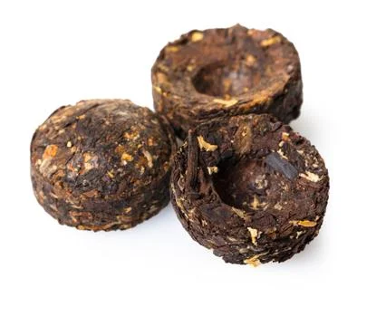 Dry black tea pressed round shape Stock Photos