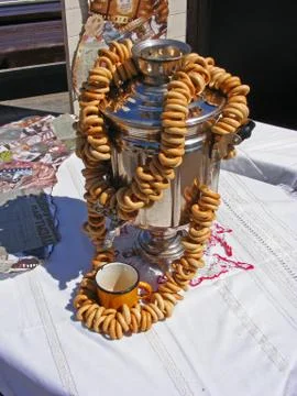 Dry bread-ring and old samovar Stock Photos
