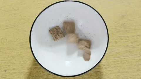 Dry breakfast cereals pads fall down Stock Footage 218017652